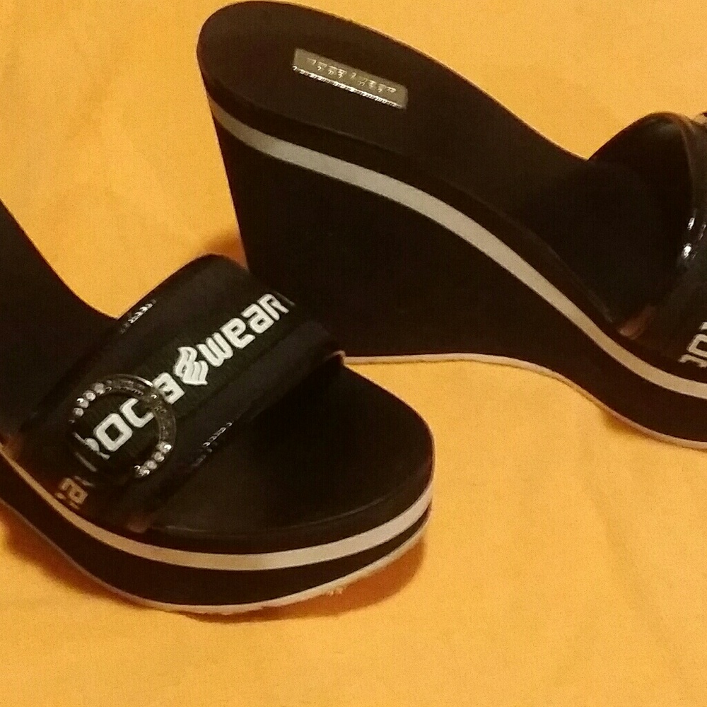 A pair of Roca a wear wedged sandal
